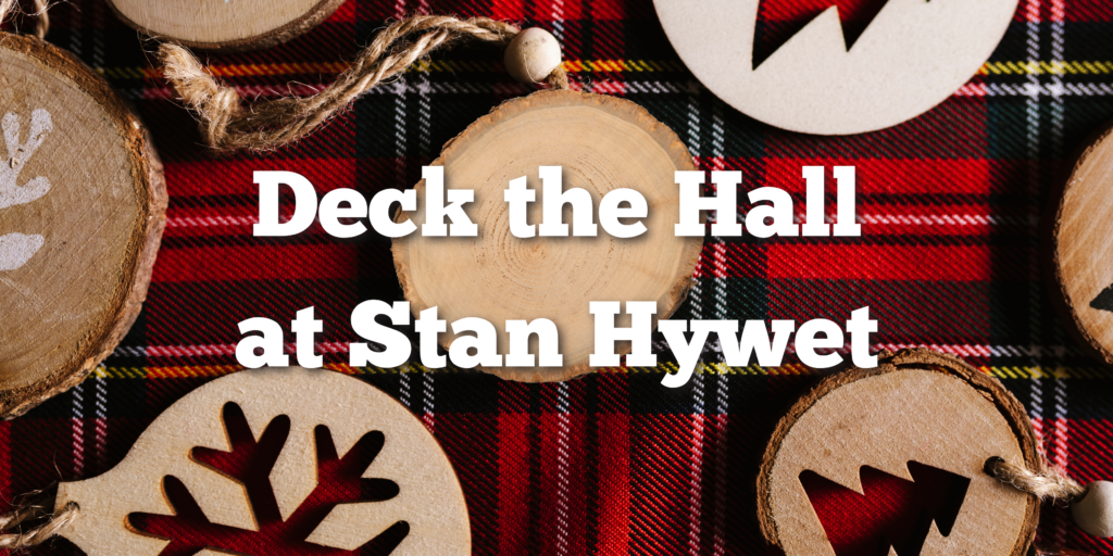 Wooden disc ornaments on a red plaid and "Deck the Hall at Stan Hywet"